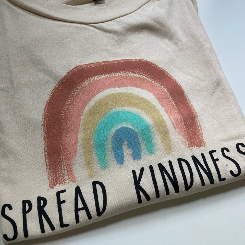 cream colored t-shirt; Dry Goods; size L
